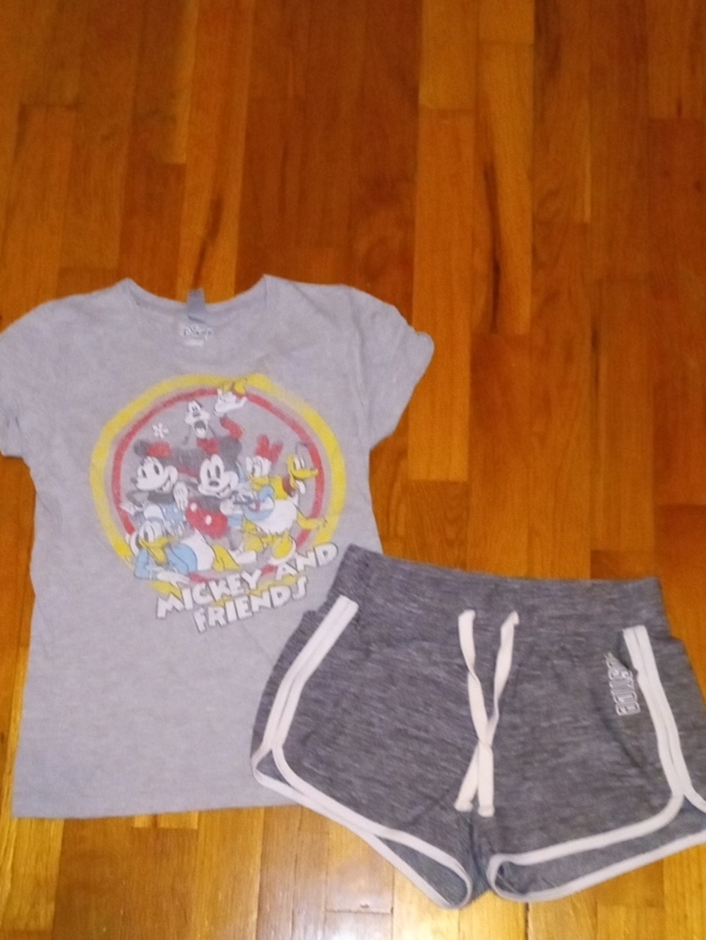 girl 10 gray drifit shorts and Mickey tee